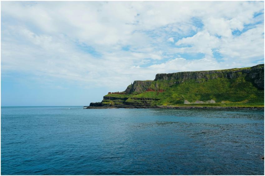 Beautiful coastal cliffs with green vegetation und