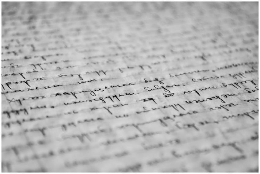 Close-up of vintage handwritten text on old paper,
