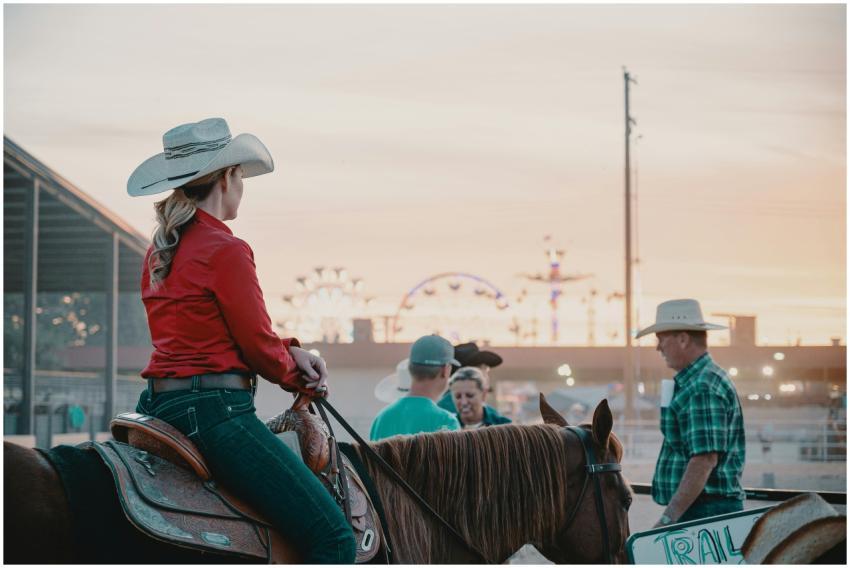 A female cowboy on horseback participates in a liv