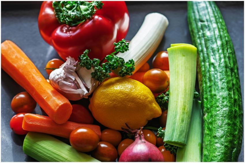 A vibrant flat lay of fresh vegetables and ingredi