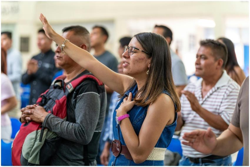 People engaged in prayer during a religious gather