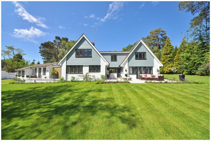 Modern family home exterior showcasing a large law