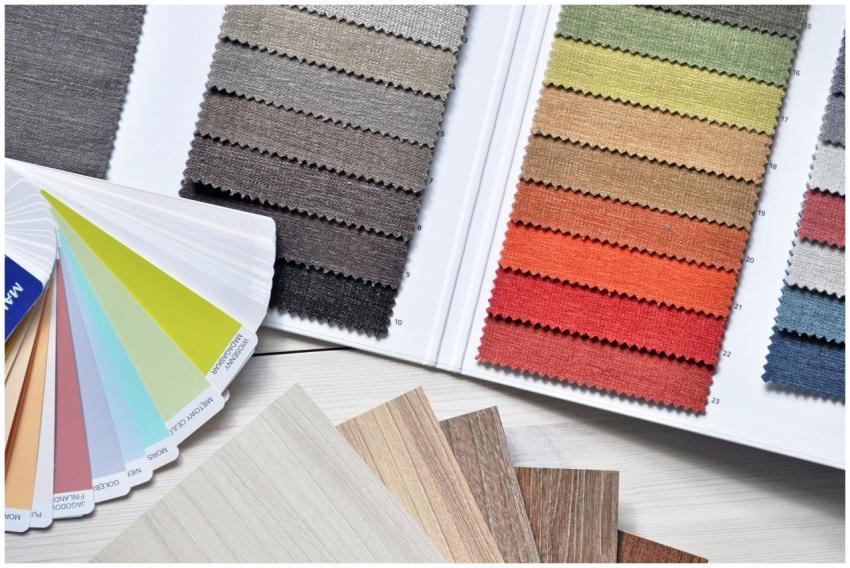 Colorful fabric and paint swatches laid out for de