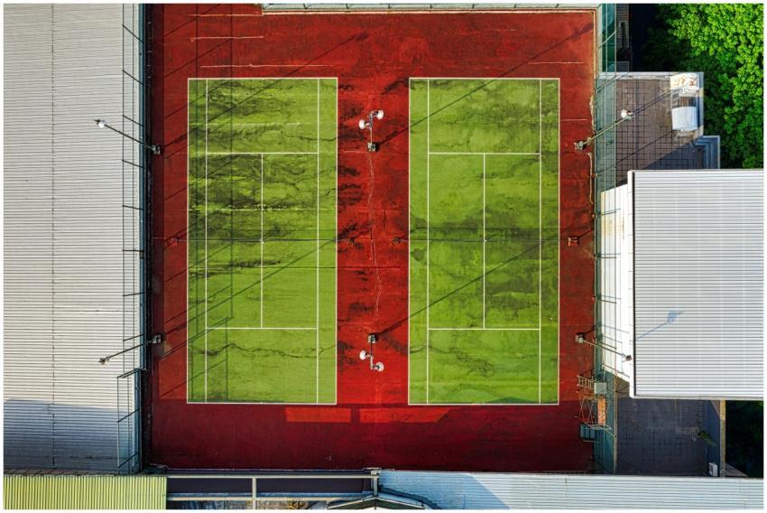 Aerial view of colorful dual tennis courts in the