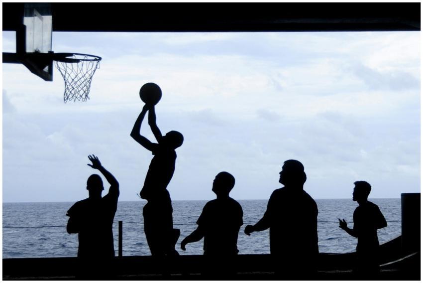 Silhouette of a basketball game played by the ocea