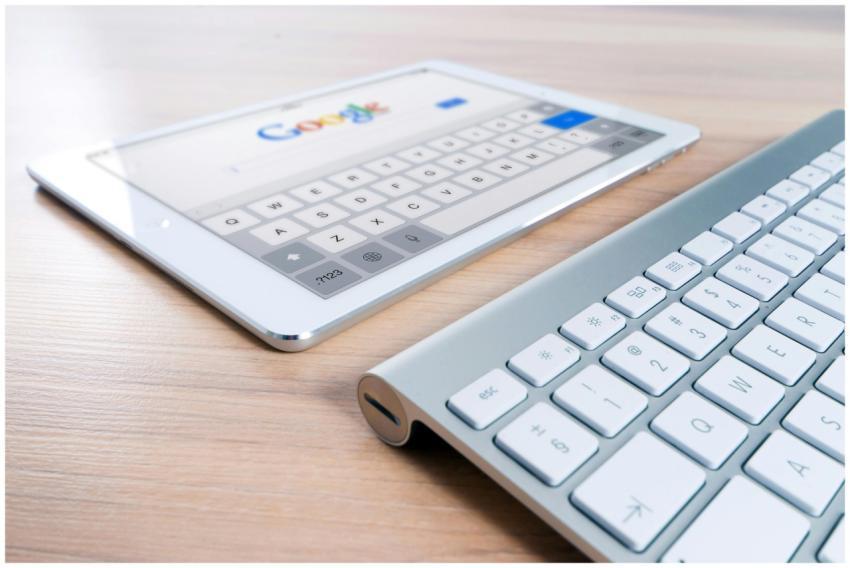 A modern tablet displaying a search engine logo ne