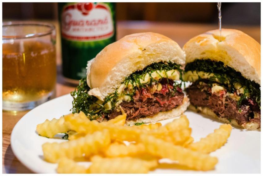 Close-up of a flavorful cheeseburger served with f