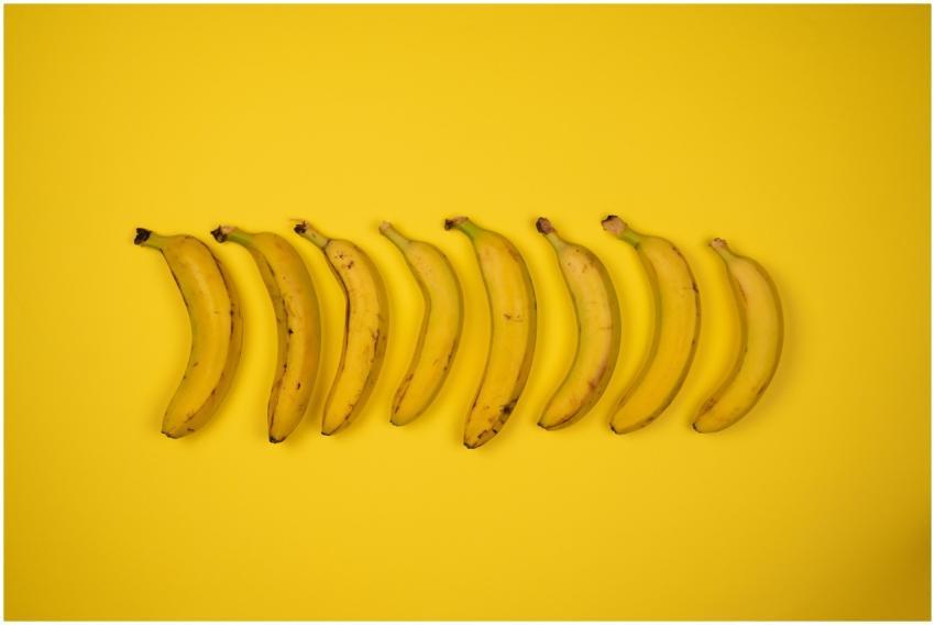 Top view of tasty ripe bananas with blots on peel