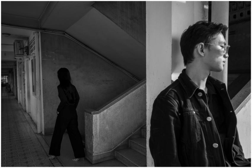 Moody black and white scene with two individuals i