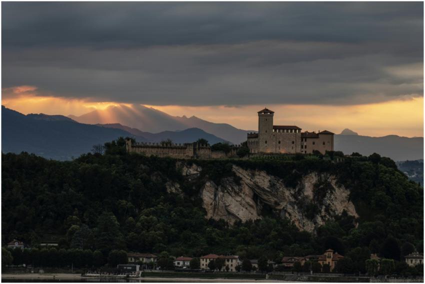 Majestic castle on a hill with sunset backdrop, ru