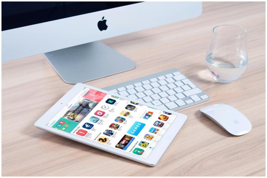 Sleek home office setup featuring an iMac and iPad