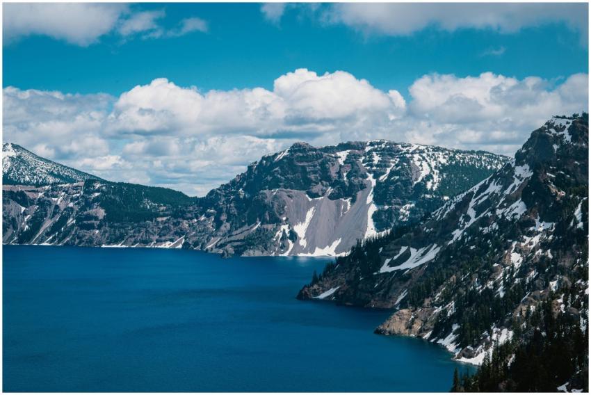 Capture the breathtaking scene of Crater Lake surr