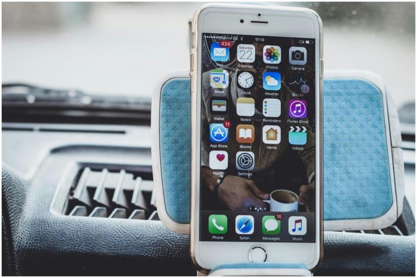 Close-up of a smartphone mounted on a car dashboar