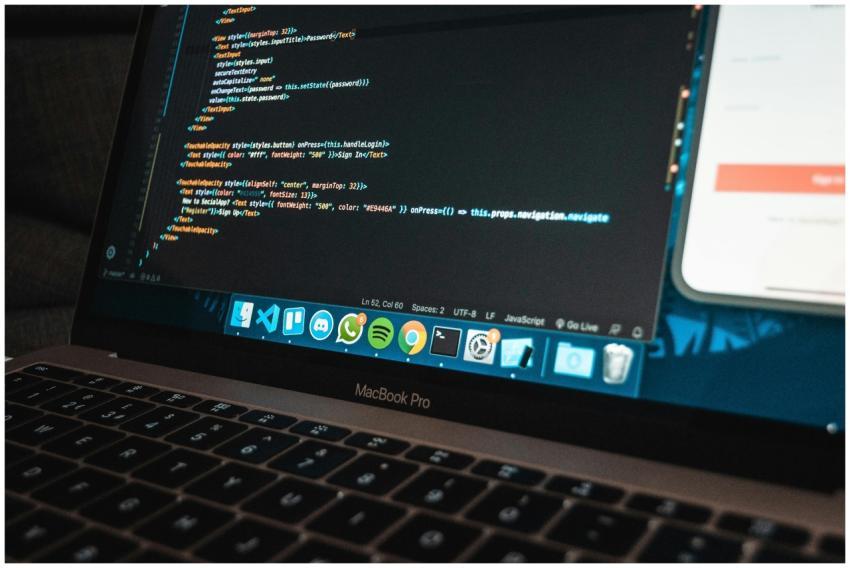 Close-up of a laptop with code on the screen, perf