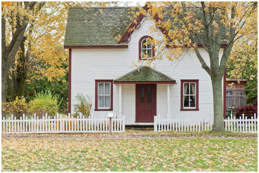 Picturesque traditional house with autumn foliage