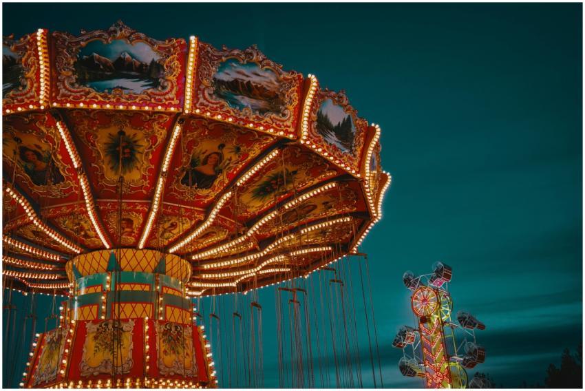 Brightly illuminated carousel at an amusement park