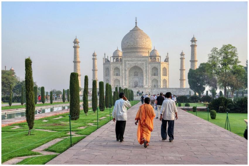 Iconic Taj Mahal with visitors exploring its grand