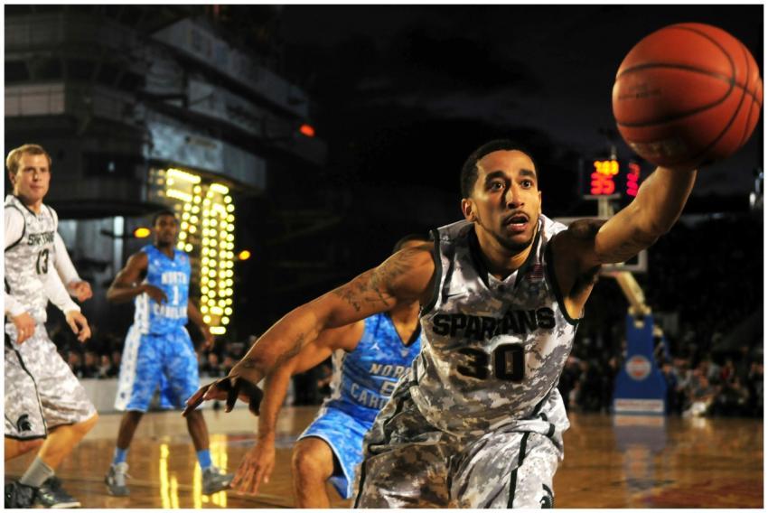 Intense basketball game with athletes in action on