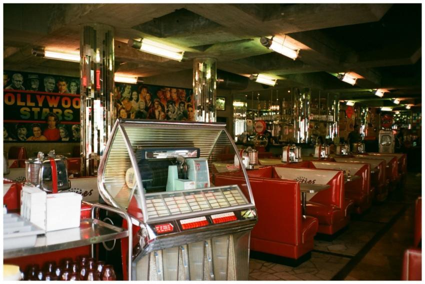 Vintage diner with red booths, jukebox, and retro