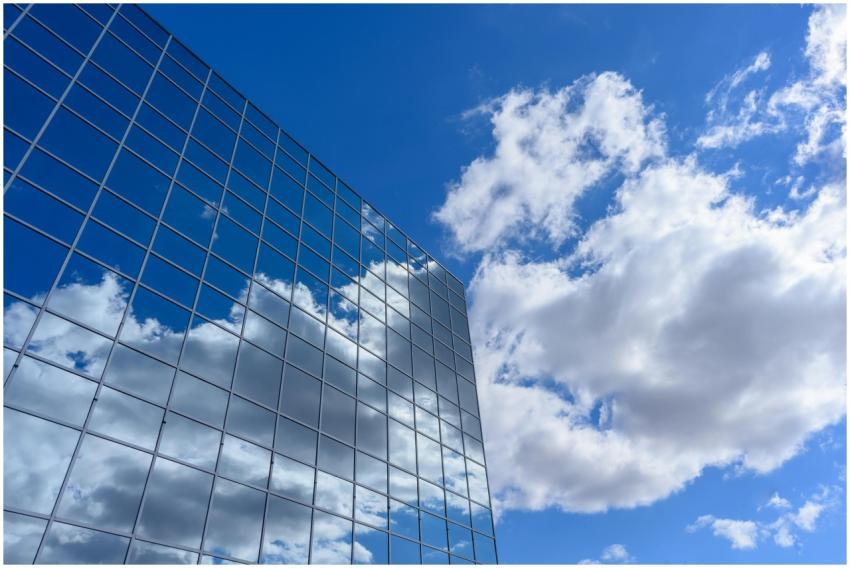 Contemporary skyscraper with glass facade reflecti