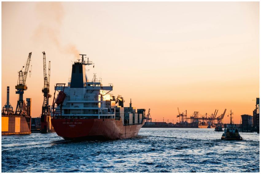 Stunning sunset view of cargo ships and cranes at