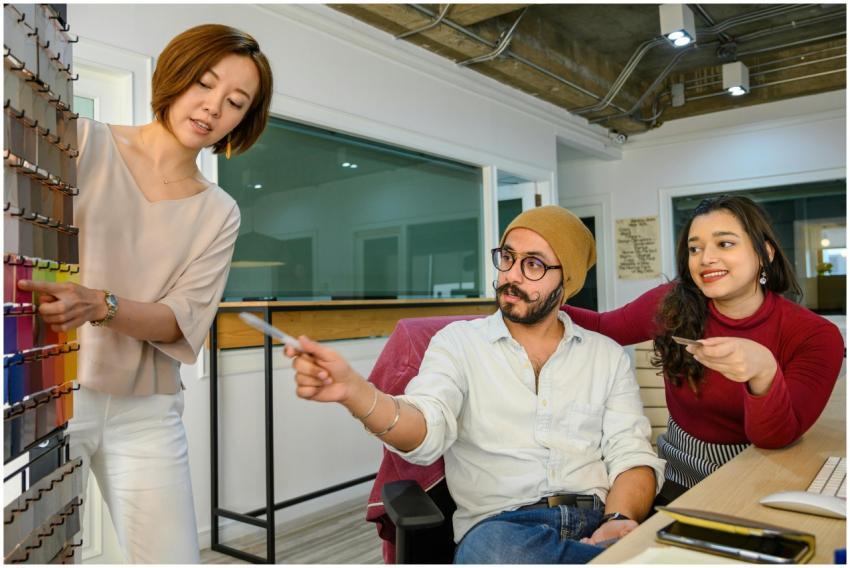 A diverse team discusses design choices in a moder