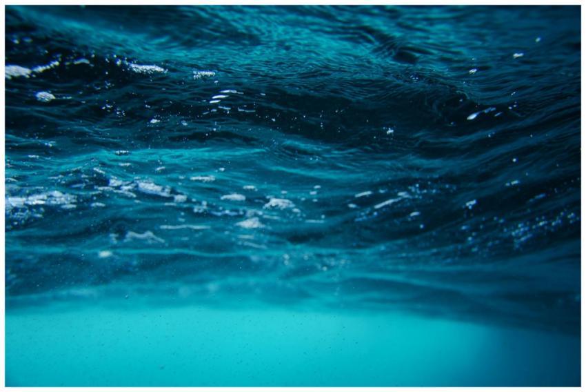 Serene underwater view of sea surface with vibrant