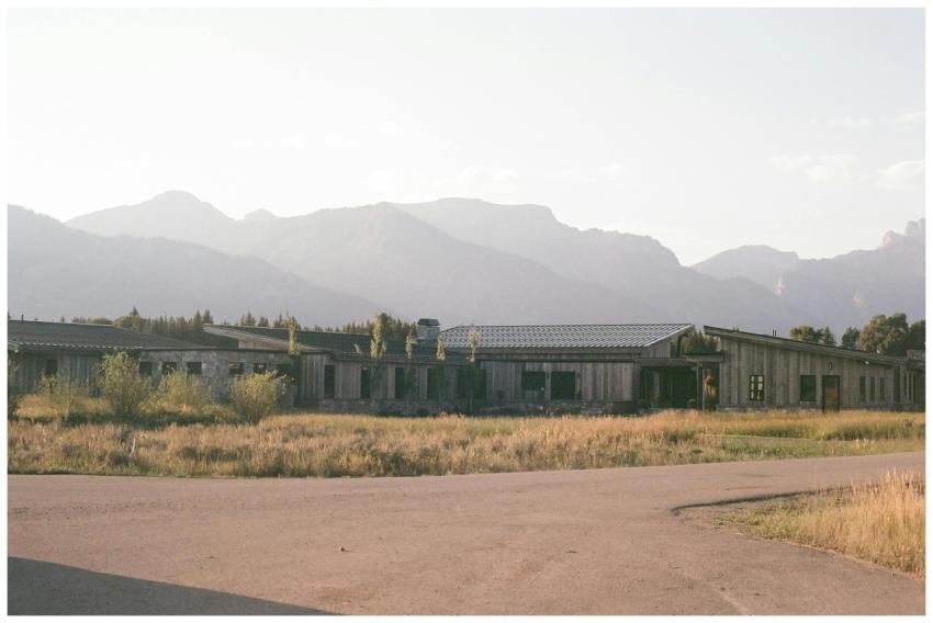 Rustic Building Mountainous Backdrop