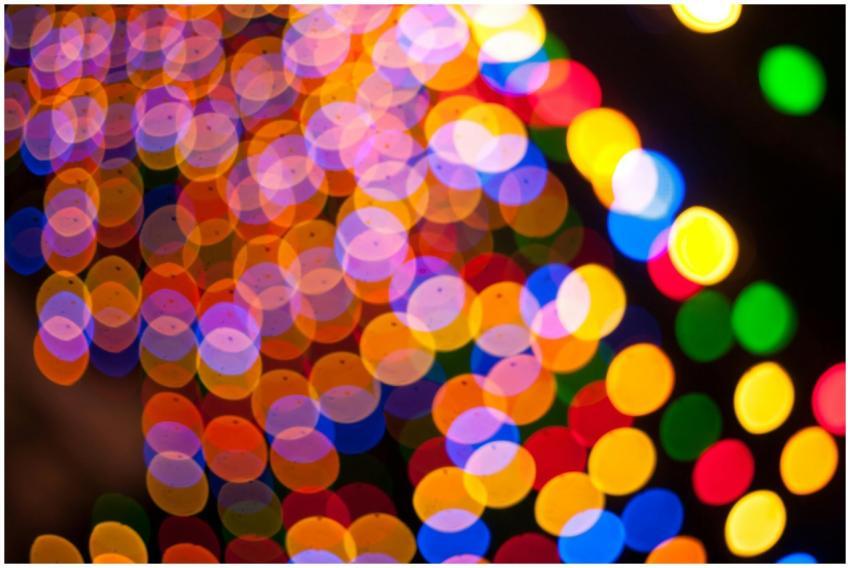 Colorful circular bokeh lights create a festive an