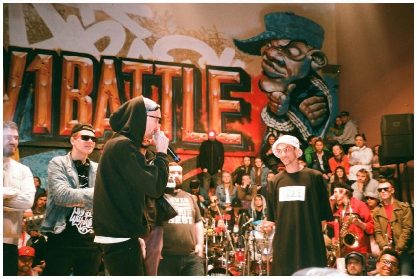 Dynamic scene of a hip hop battle with performers