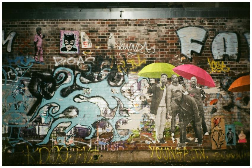 Colorful graffiti and street art featuring umbrell