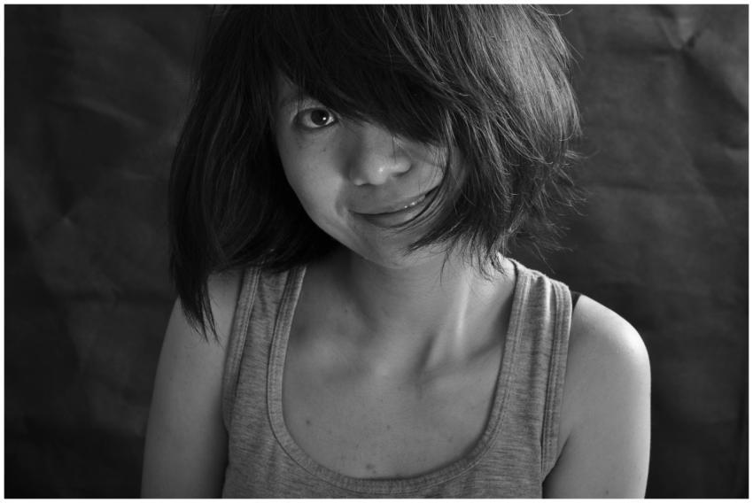 Black and white portrait of a young woman with sho