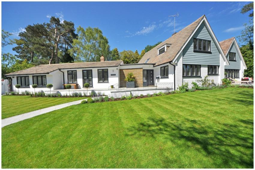 Contemporary house exterior with large manicured l