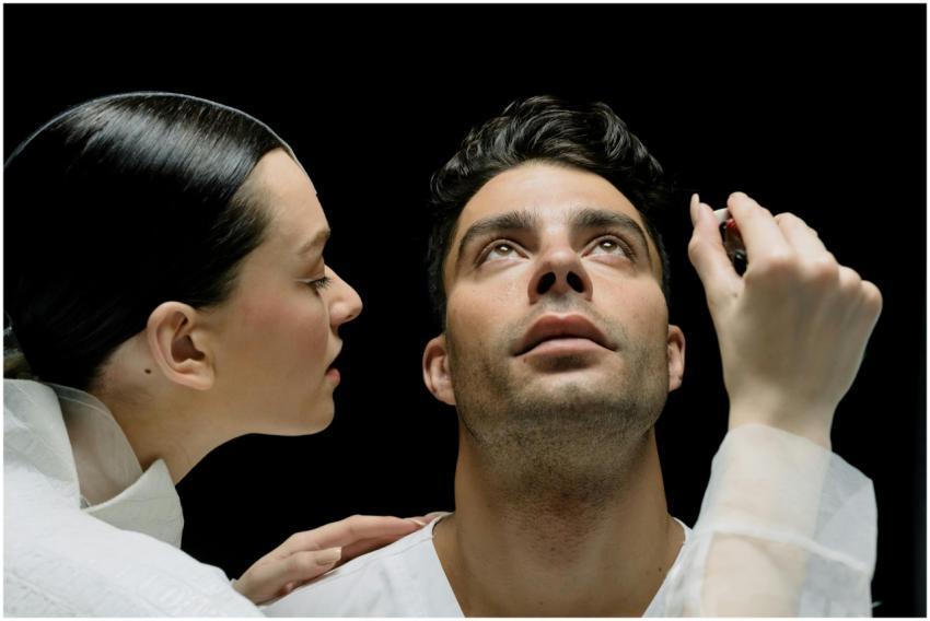 A medical professional examining a patient's eye c