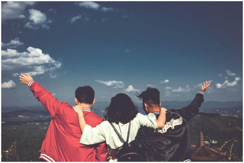 A joyful moment with friends overlooking a scenic