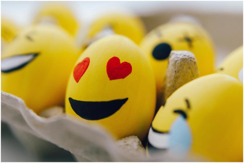 Bright yellow emoji Easter eggs with fun expressio