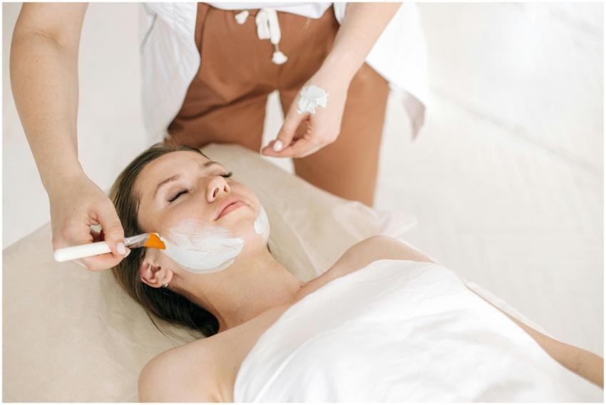 Woman receiving a rejuvenating facial treatment at