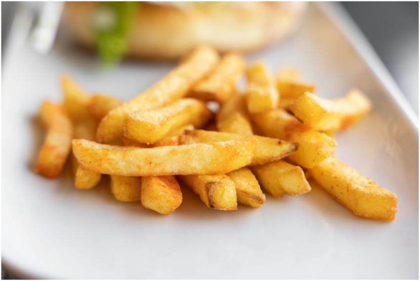 Close-up of crispy golden french fries served on a