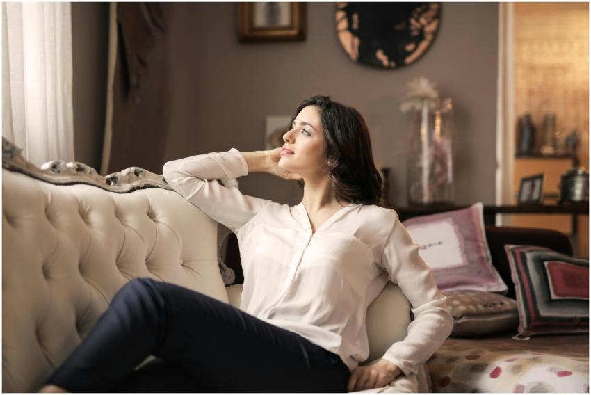 A serene woman enjoys a moment of reflection on a