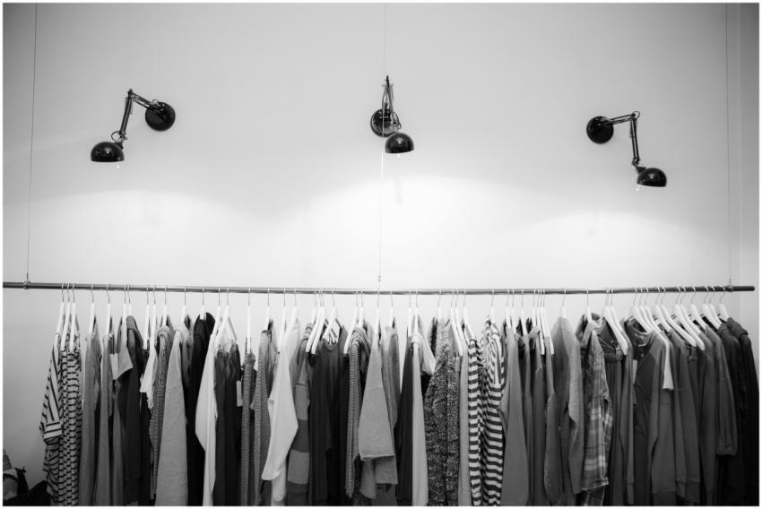 Minimalist black and white clothing display in a s