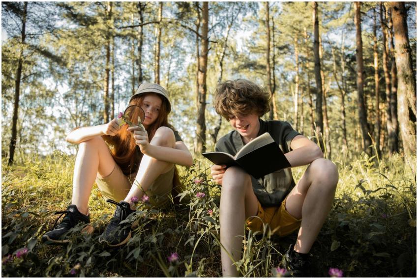 Two kids exploring a forest, enjoying nature and r