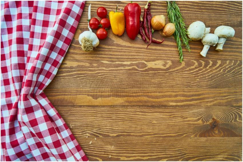 Fresh vegetables and spices on a rustic wooden tab