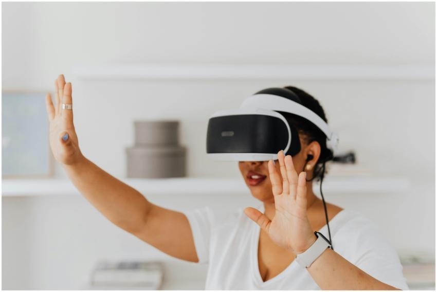 Adult woman using virtual reality headset indoors