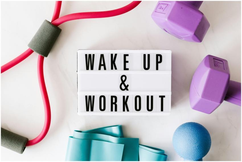 Flat lay of fitness equipment with a motivational