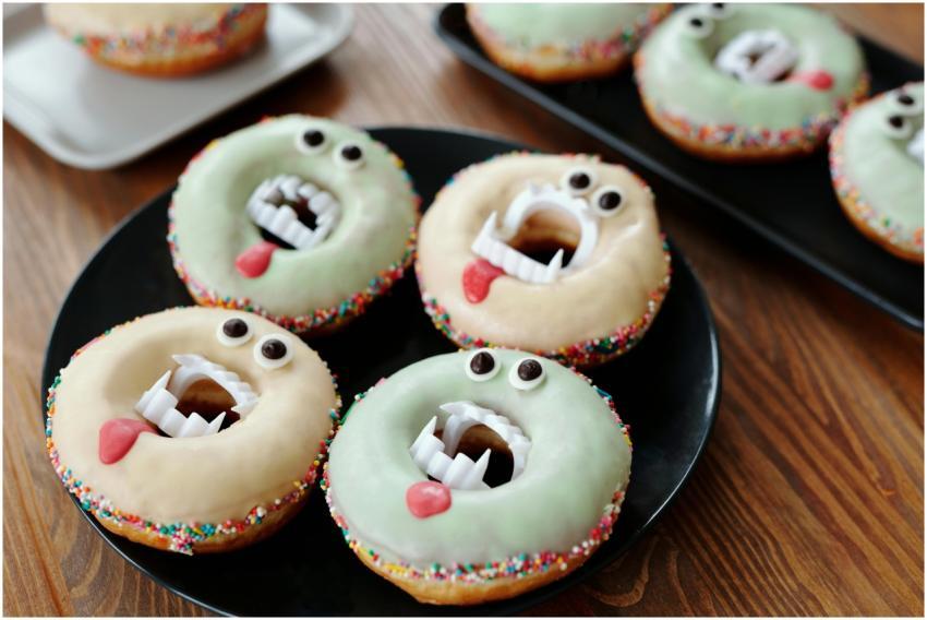 Colorful monster-themed donuts with spooky eyes an