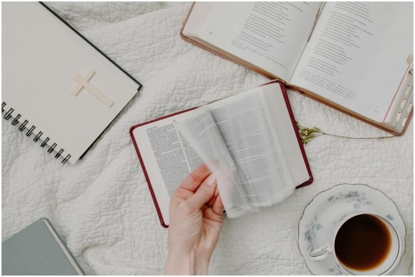 A cozy setup of Bible reading with a cup of coffee