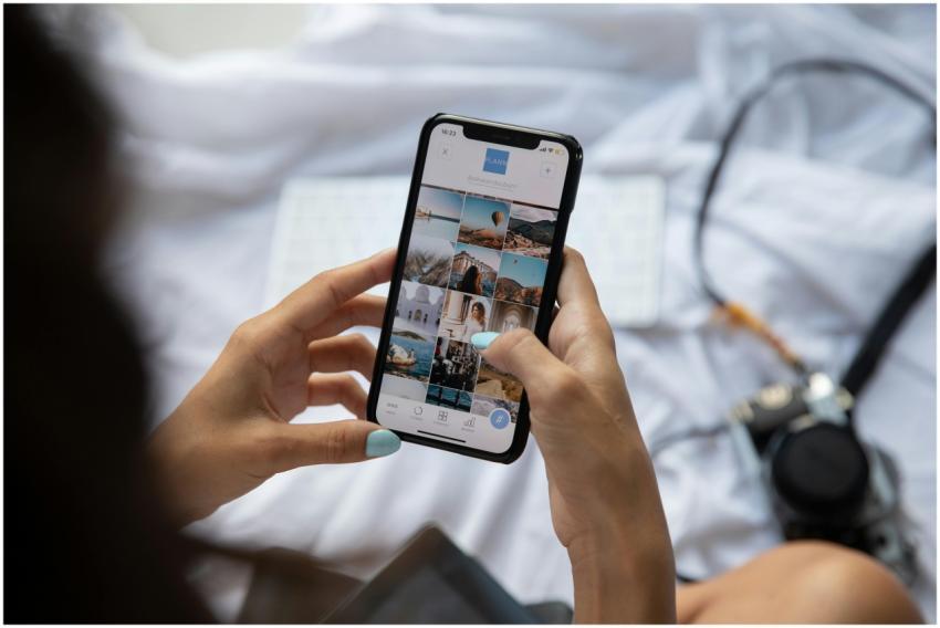 A person interacts with a smartphone displaying so