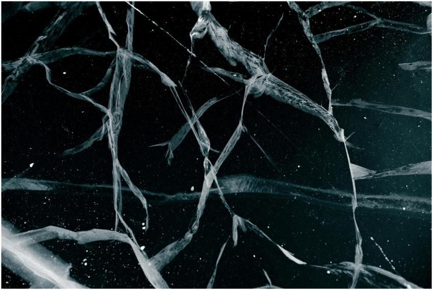 Close-up abstract view of cracked ice on a frozen