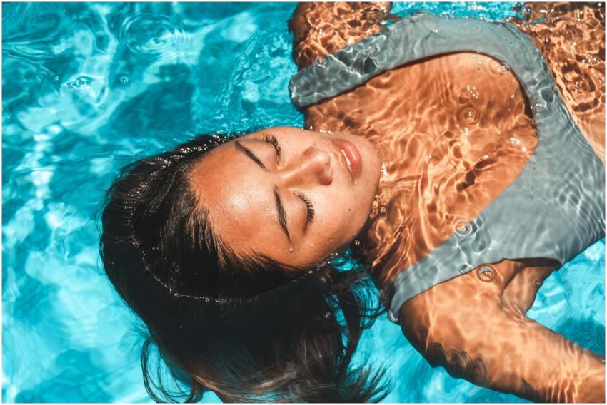 A serene portrait of an Asian woman floating with