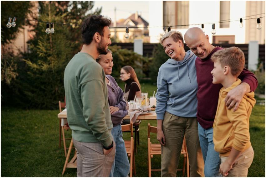 A joyful family gathering outside on a sunny day,